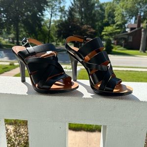 KORS. Black leather, straps heels. Size 6.5. Minimal wear, great shape